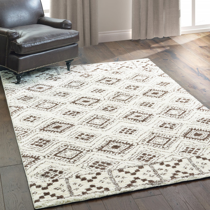 6' x 9' Ivory and Brown Geometric Shag Power Loom Stain Resistant Area Rug