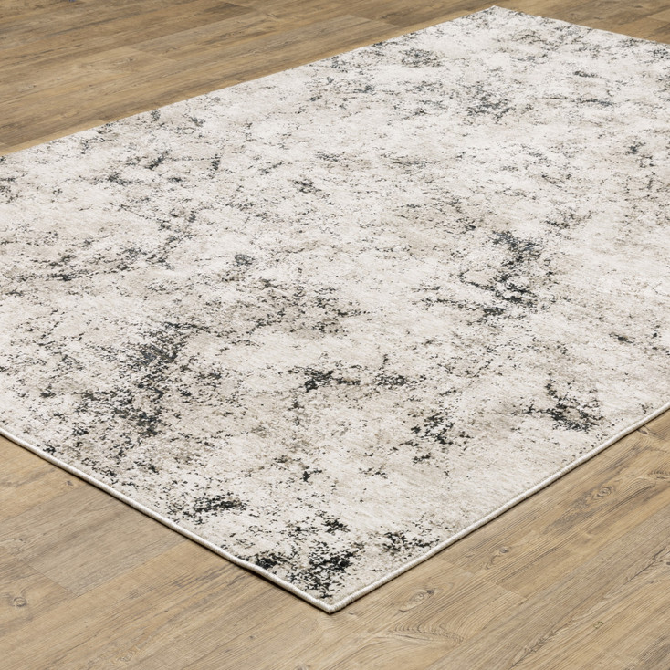 6' x 9' Ivory Grey Black Beige and Tan Abstract Power Loom Stain Resistant Area Rug