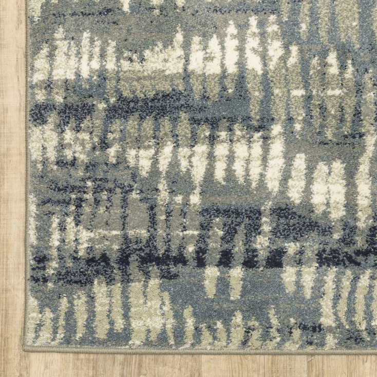 6' x 9' Grey Beige Blue and Light Blue Abstract Power Loom Stain Resistant Area Rug