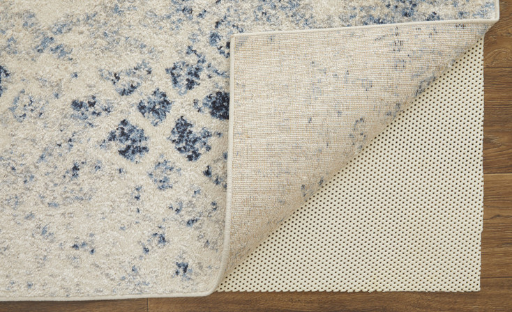 7' x 10' Ivory and Blue Abstract Power Loom Distressed Area Rug