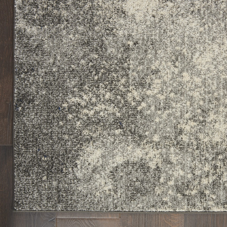7' x 10' Gray and Ivory Abstract Power Loom Area Rug