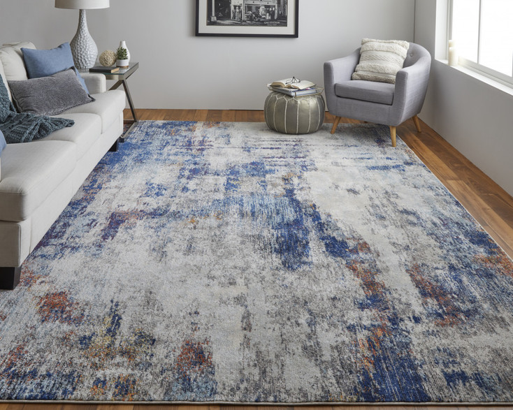 7' x 10' Ivory and Blue Abstract Power Loom Distressed Stain Resistant Area Rug