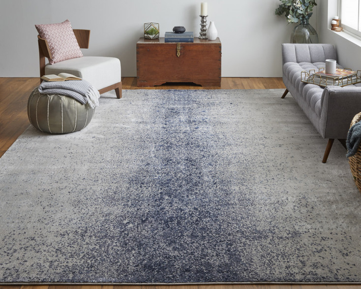 7' x 10' Ivory and Blue Abstract Power Loom Area Rug