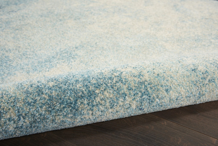 7' x 10' Ivory & Blue Abstract Power Loom Polypropylene Area Rug