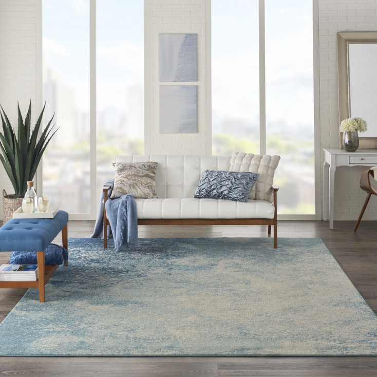 7' x 10' Ivory & Blue Abstract Power Loom Polypropylene Area Rug