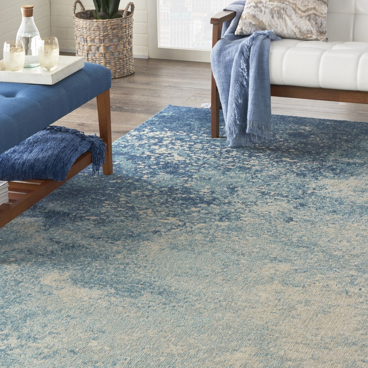 7' x 10' Ivory & Blue Abstract Power Loom Polypropylene Area Rug