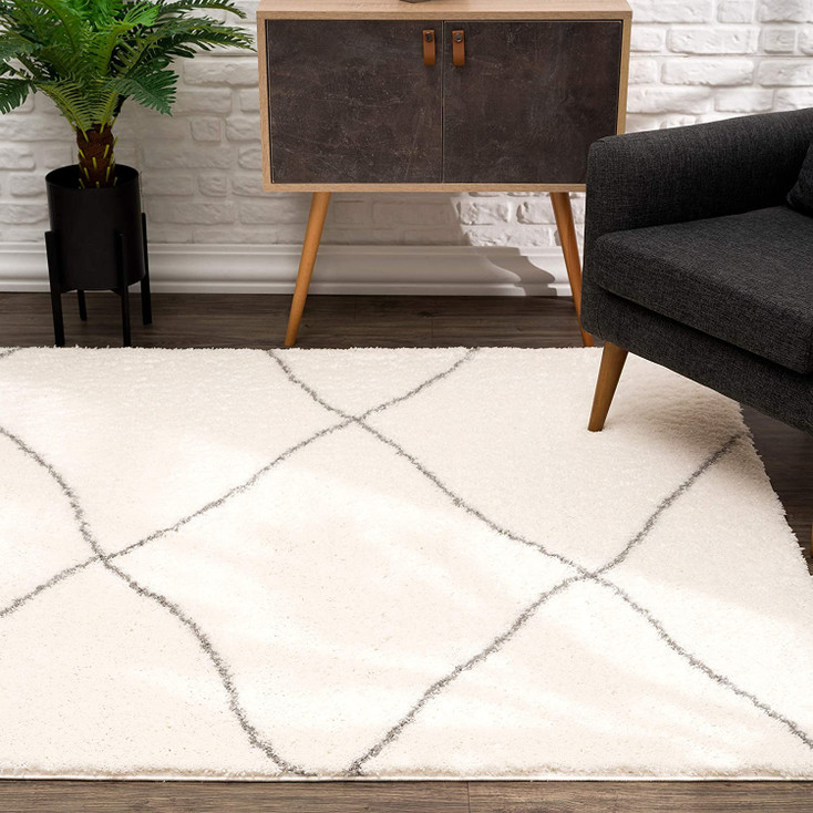 7' x 9' Ivory Modern Uneven Lattice Area Rug