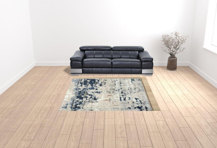 7' x 9' Beige Cream Blue and Gray Abstract Stain Resistant Area Rug