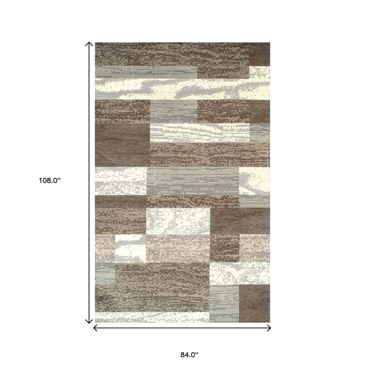7' x 9' Light Blue and Ivory Patchwork Power Loom Stain Resistant Area Rug