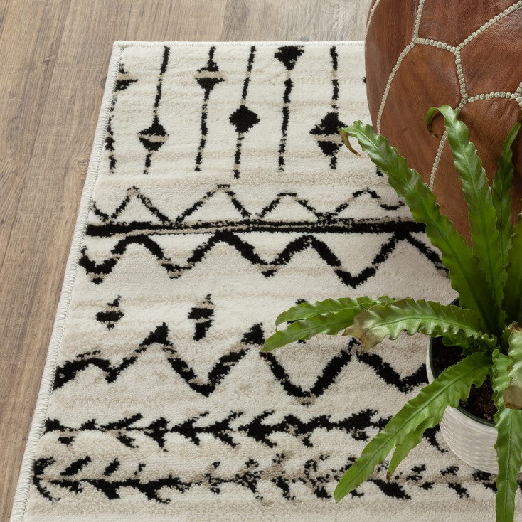 8' x 10' Ivory and Black Eclectic Patterns Indoor Area Rug