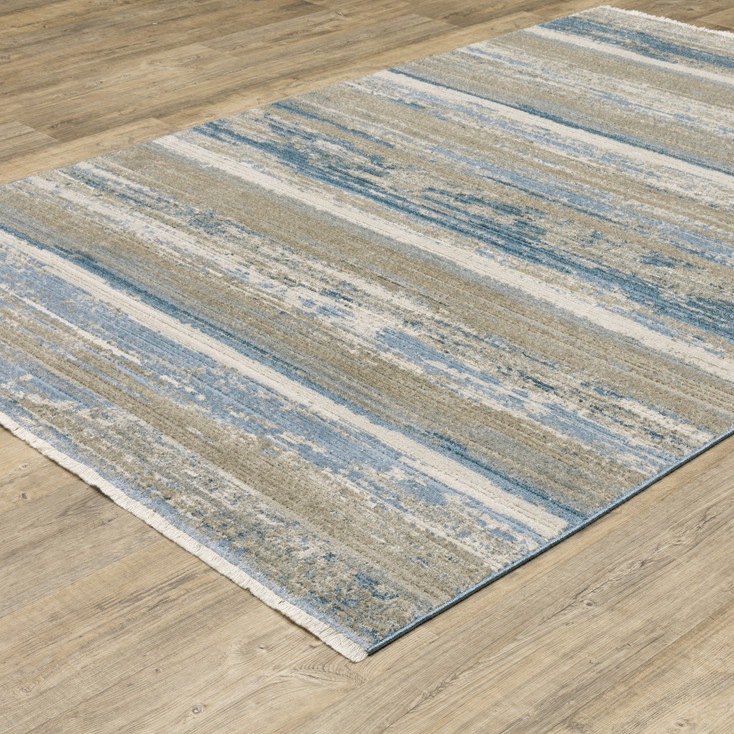 8' x 11' Ivory Beige Grey Blue and Tan Abstract Power Loom Area Rug with Fringe