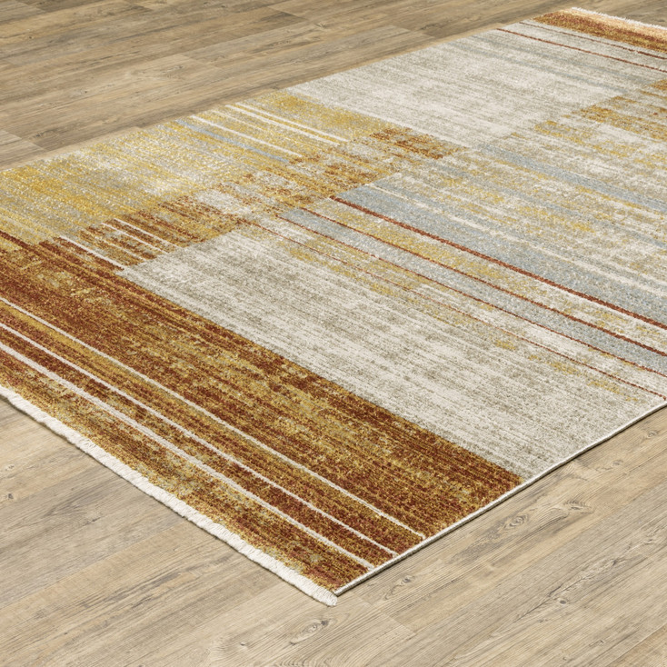 8' x 11' Rust Gold Blue Grey Ivory and Tan Geometric Power Loom Area Rug with Fringe