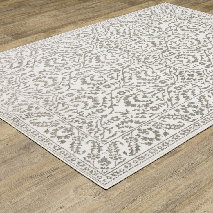8' x 11' Grey and White Floral Power Loom Stain Resistant Area Rug