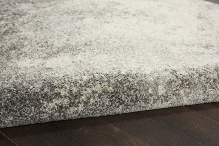 5' Gray and Ivory Round Abstract Power Loom Area Rug