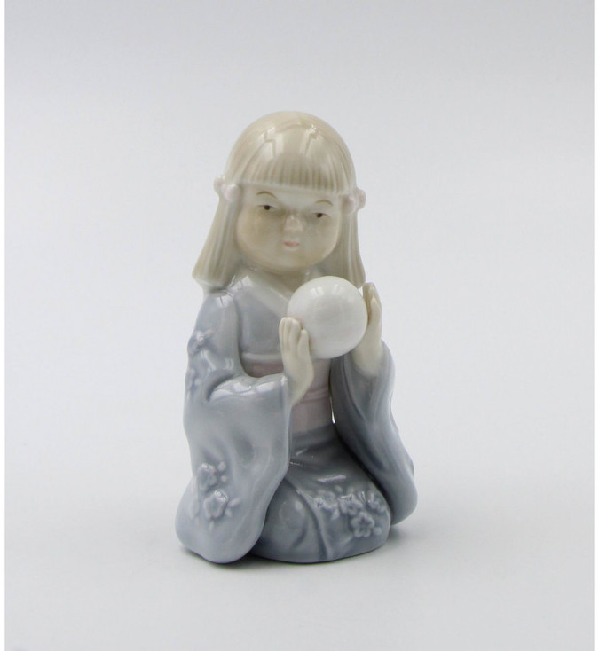 Miniature Geisha Holding a Ball Porcelain Sculpture