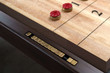 Recessed scoring markers integrated into shuffleboard surface on George table