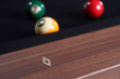 Close-up of mother-of-pearl diamond sights set into the rail of the Doc & Holliday Kaci pool table