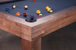 Alta slate pool table in Honey Ash styled in a modern game room showcasing relaxed Parsons design and contemporary appeal