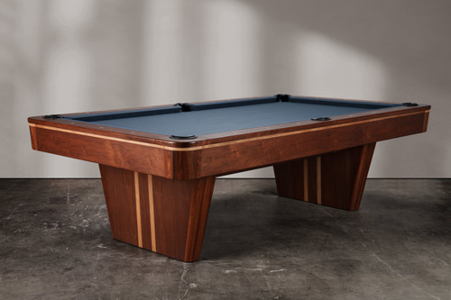Three-quarter angle view of the Doc & Holliday Preakness pool table, showing the walnut finish, maple racing stripe detail, and pedestal base design.