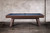 Side view of the Doc & Holliday George pool table in Antique Coffee photographed in a minimalist studio setting