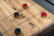 Maple butcher block playfield on George shuffleboard table with polymer-coated surface