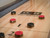 Close-up of the Doc & Holliday Billiards Paula Parsons Shuffleboard Table maple butcher block playfield, showing natural wood grain and smooth polymer-coated surface.