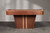 Close-up view of the pedestal leg on the Doc & Holliday Preakness pool table, highlighting the walnut finish and vertical maple racing stripe detail.