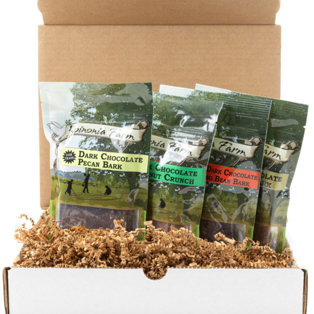 An open Gift Box showing 3 items in the Koinonia Fair Trade Chocolate Sampler Box