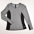 This is a black and grey size M long sleeve activewear shirt by RBX.