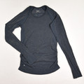 This grey sparkly activewear shirt by Athleta has long sleeves, and is a size XS.