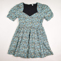 This teal floral dress by BP is a size M.