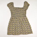 This yellow floral dress by AUW has a smocked top, with peasant style neck and sleeves, and is a size XL.