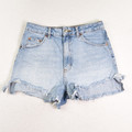 This Topshop brand pair of blue denim cutoffs is a size 6.