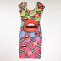 This bright, colorful, silky dress by Cleo has a pattern of open mouths, and is a Size M.