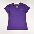 This is a women's purple Nike activewear shirt, size S.