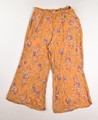 This is a pair of summery, gold floral pants by Patrons of Peace, Size M.