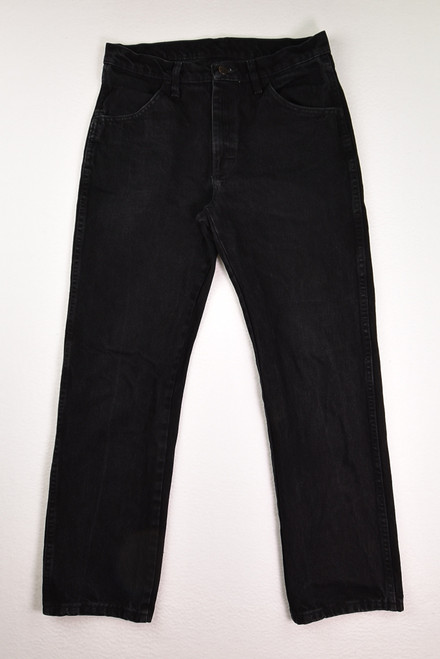 This is a pair of black denim Rustler jeans, size 32 x 30.