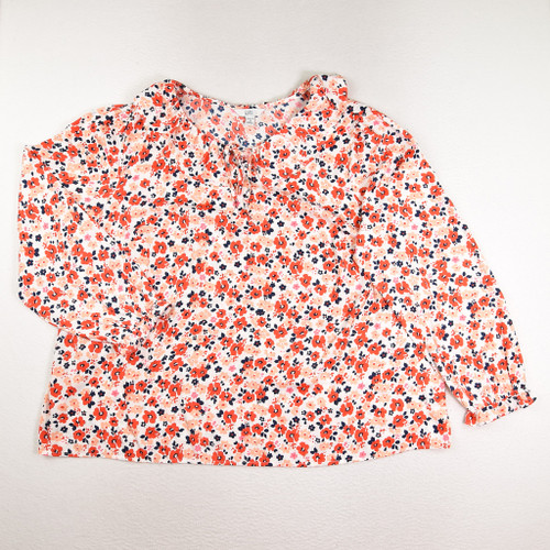 This is a cream blouse with red, blue and peach flowers and a ruffle at the neck, size 2X, by Croft & Barrow.