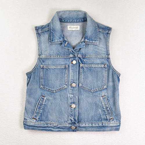 This is a blue denim vest by Madewell, women's size M.