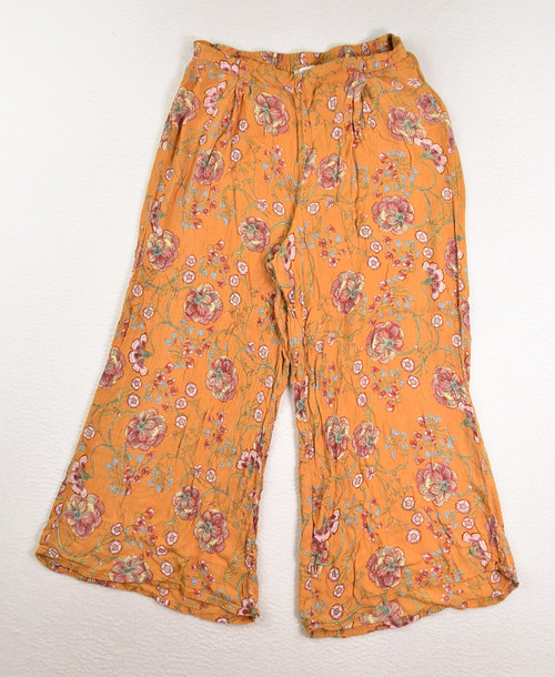 This is a pair of summery, gold floral pants by Patrons of Peace, Size M.
