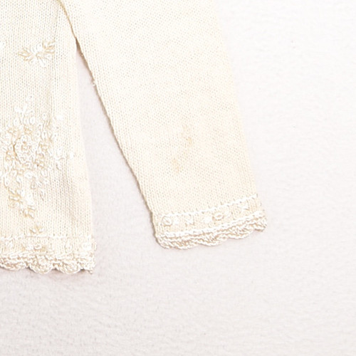 Note small stain on left sleeve.