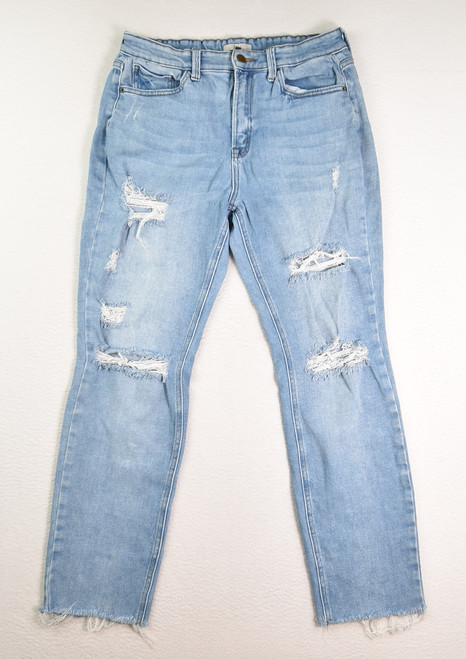 This is a pair of women's blue denim distressed jeans by Zili, Size 29.