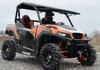 SuperATV scratch resistant flip out windshield on an orange and black Polaris General 1000, front three-quarter view