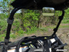 View from the RZR cab of the SuperATV windshield upper clamp straps on the roll cage beside the rear view mirror