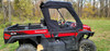 Side X Side upper doors and rear window on a red Kawasaki Mule Pro FXR, driver side view in a field