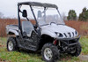 Full side front view of the silver Yamaha Rhino in a field with the SuperATV full windshield and roof installed