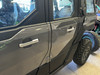 Front door of a gray Polaris Xpedition showing the Dirty Teeth Racing billet exterior door handle