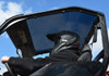 Underside view of the SuperATV tinted roof on the Polaris General cage with a helmeted driver below