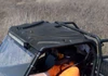 SuperATV plastic roof on a full size Polaris Ranger with an LED light bar under the front edge, seen from above
