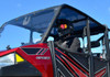 Side view of the SuperATV tinted roof over the Polaris Ranger XP 900 Crew cab with a helmeted driver